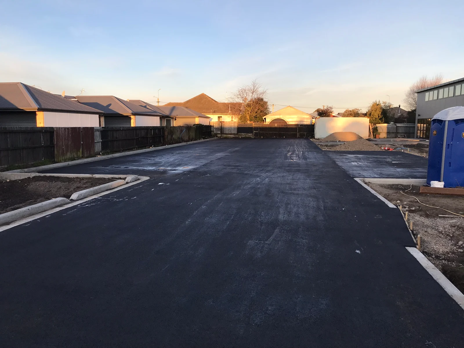 Completed paved car park and prepared surrounding ground