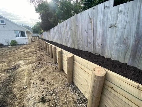 Completed timber boundary retaining wall with backfill