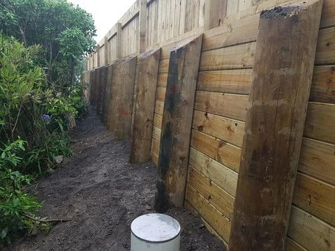 Timber retaining wall on a narrow sloping site